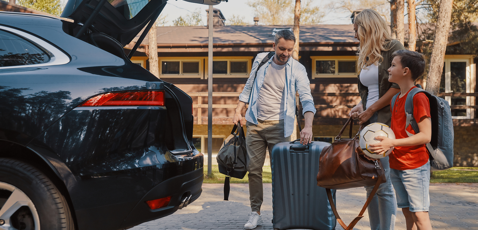Family packing their car for a road trip