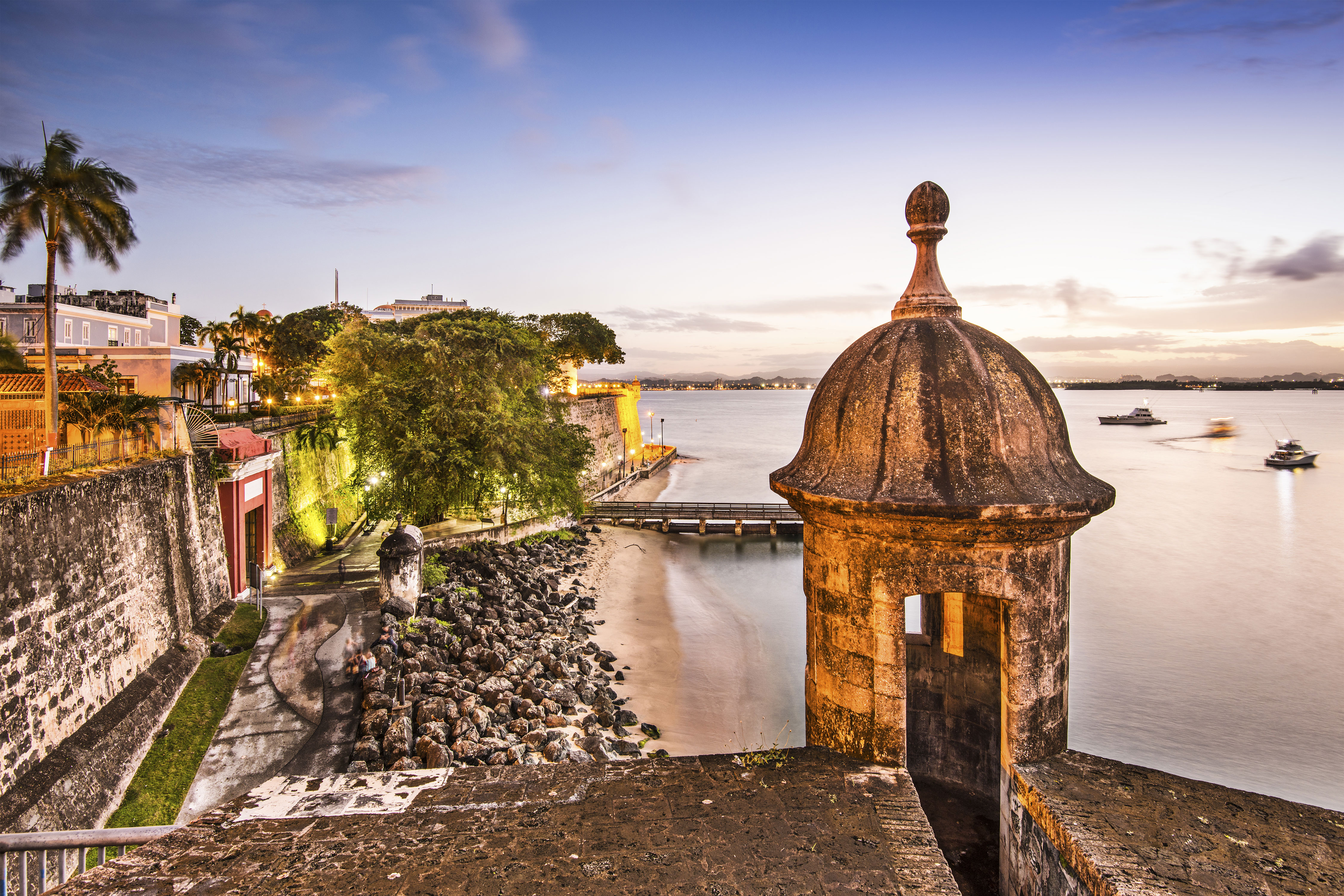 Sunset coastal view with Spanish colonial fortress and walls