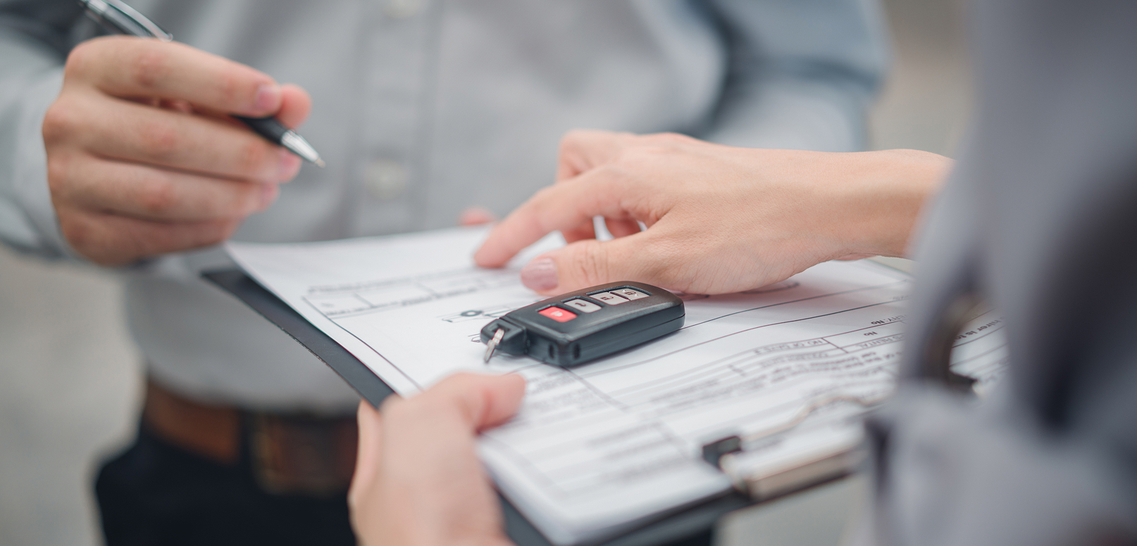 Person signing rental car paperwork