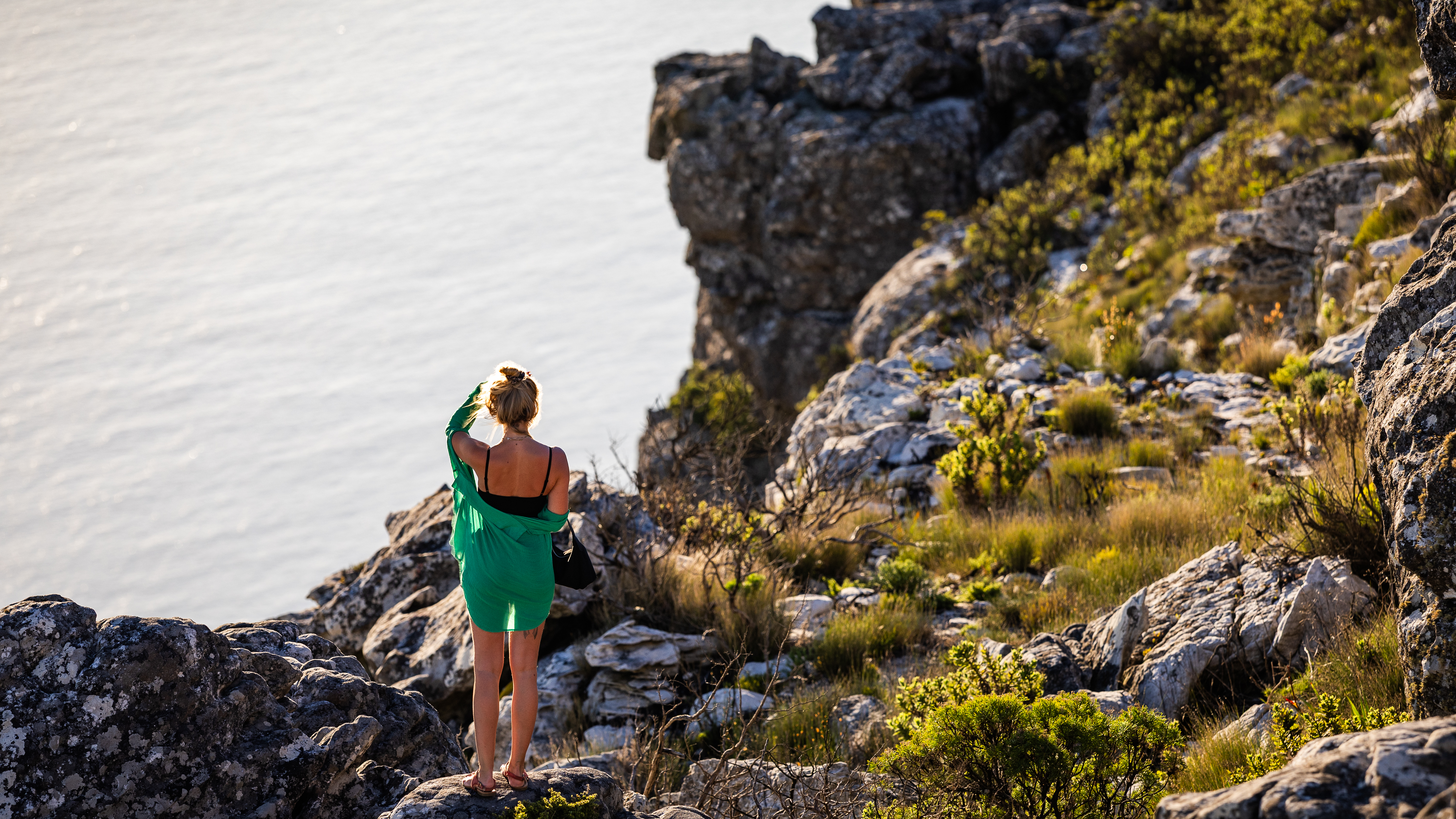 Person walking on rocky coastline
